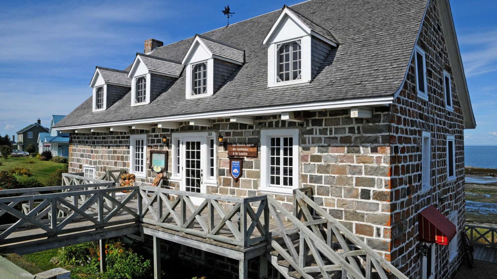 coastal house with stone veneer siding