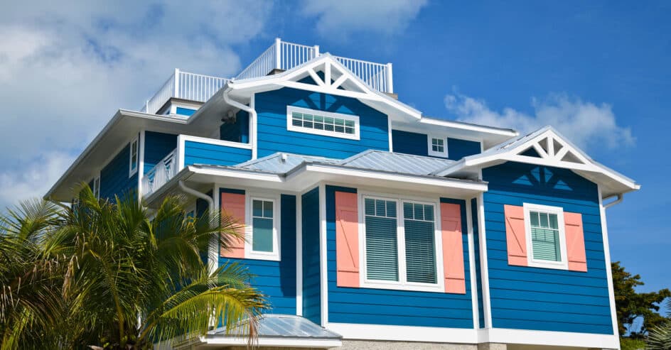 luxurious costal house with blue vinyl siding